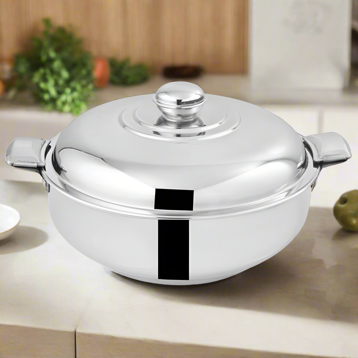 Stainless steel pot with lid on a white background