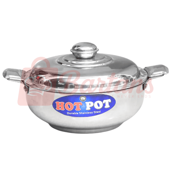 Stainless steel hot pot with a clear lid on a white background