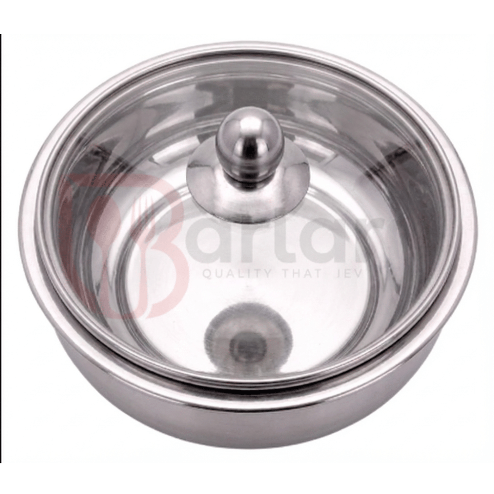 Stainless steel pot with glass lid on a white background,